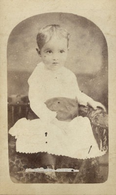 Toddler Clad in Long Light-Coloured Dress