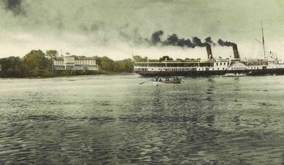 Postcard of the Queen's Royal hotel and the Steamship Corona on the Niagara River.