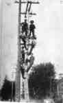 Men on an Electrical Pole