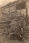 Four Men in Front of New Passenger Train Car