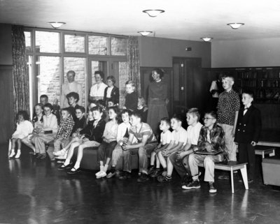 LH2978 OPL Children's Reading Room- Miss Irene Boes; Miss Barbara Smith; Miss Hilde Albrecht with Children