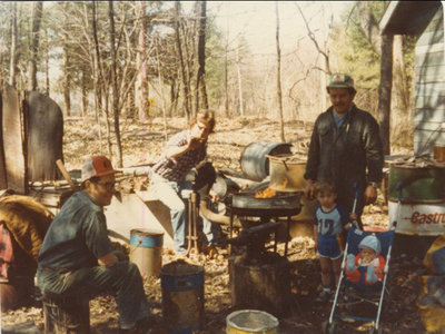 Stonemasonry - left to right - Allan Fraser, Tim Fraser, Dan Fraser, small boy Lorne Fraser , baby Matt Fraser - Sharpening stone hammers - #21 Hyw 632 - 3 generations - RI0188