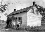 Jonathan Thomlinson at his square-timbered house in Rideau Ferry c.1915