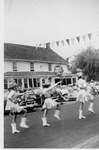 Elgin Centennial parade 1956 - Drum Majorettes in front of Halladay Red and White store