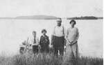 Bill Acton (1918-1999), his sister Estelle, mother Marguerite and father Edward at Opinicon Lake homestead c.1925