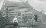 Margaret (Stout) Ferguson and Elizabeth Ferguson in front of Stout cabin.