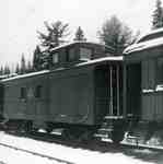 Caboose and retired wooden coach.  Coach was built new in Preston Ontario 1912  Nov 1971  (photo: b&w)