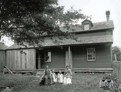 Rural Family in Front of Wooden Frame House, c. 1902-1906