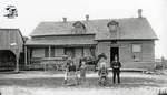 Family in Front of Old Wooden Farm House, c. 1902-1906