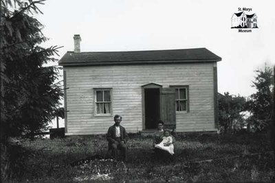 Small Rural House, Man, Woman and Baby, c. 1902-1906