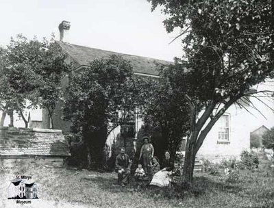 Family with Brick Farm House, c. 1902-1906