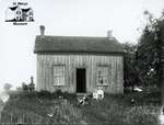 Board and Batten House with Family, Steam Engine, c. 1902-1906