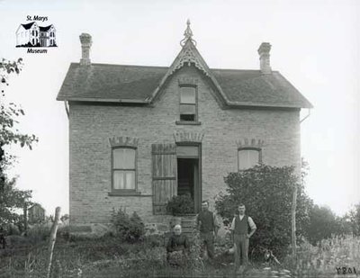 Two Men and a Woman with Brick Farmhouse, c. 1902-1906