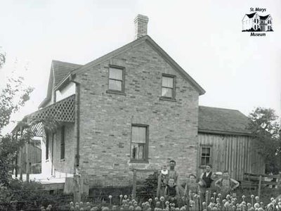 Farm Family In Front of Brick House, c. 1902-1906