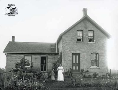 Woman and Two Children on Farmstead, c. 1902-1906