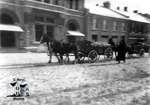 Horses with Wagons in Front of Post Office at Winter