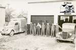 Public Utilities Crew in Front of Garage
