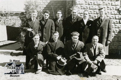 Group Standing in Front of Limestone Building