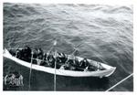 Navy Members Rowing a Boat