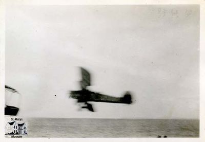 Airplane Flying by the HMCS Stone Town