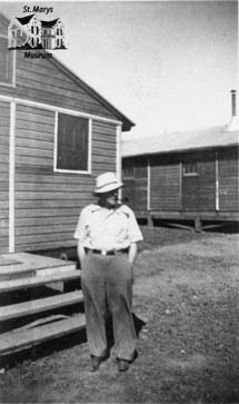 Man in Front of House