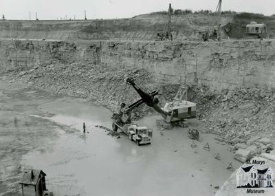 Electric Shovel and Side Dump in Old Quarry