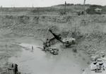 Electric Shovel and Side Dump in Old Quarry