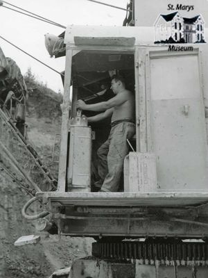 Cement Plant Worker Using Electric Shovel