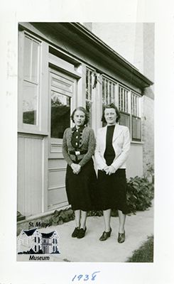 Isabelle and Another Woman Outside the Chesterfield Home