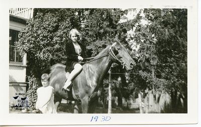 Isabelle Chesterfield on Horseback with Young Boy