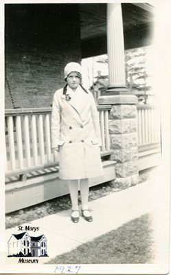 Teenage Isabelle Chesterfield in Front of Her Family Home