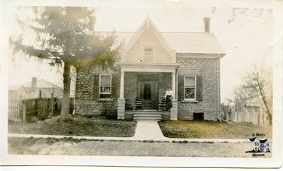 House with Woman on Front Porch