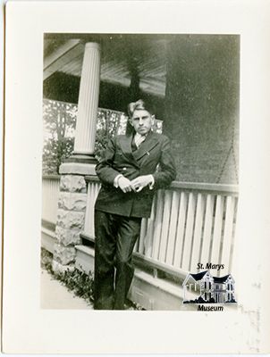 Charles Chesterfield Standing Outside Family Home