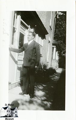 Bruce Chesterfield Standing Outside Family Home