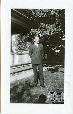 Bruce Chesterfield Standing Outside Family Home