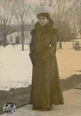 Woman Standing Outside in Fur-trim Coat
