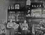 Mrs. Clench and Miss Cruttenden in the living room of the Clench home