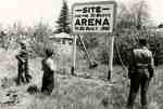 Boys looking at sign proclaiming future arena site, ca. 1949-50