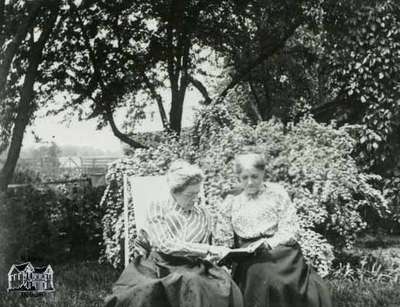 Mrs. Clench and Miss Elizabeth Cruttenden in the garden of the Clench house