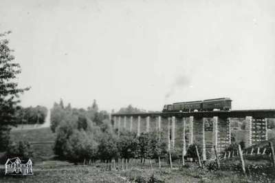 London railway viaduct with passenger train, 1901