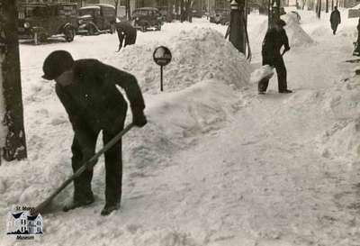 Shoveling snow on Queen Street