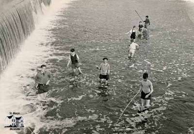 Boys fishing beneath the falls (2 pictures)