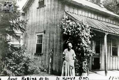 Regina Riddell in front of Widder Street East home