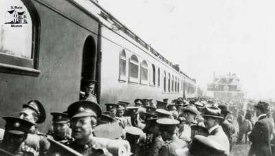 249th Battalion boarding train at station in Regina