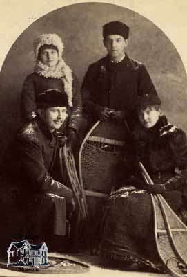 Two Men, and Two Women with Snowshoes