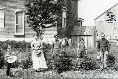 Detail from frame farmhouse with family grouping  (CI1071)