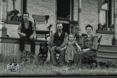 Detail from Brick Home with Family