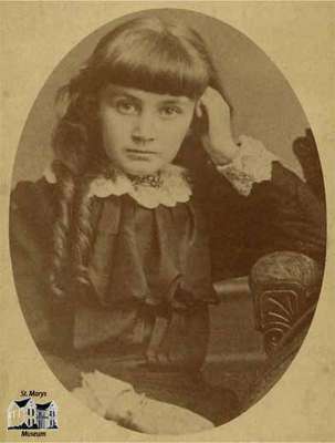 Young girl with ringlets; seated