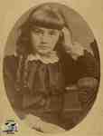 Young girl with ringlets; seated