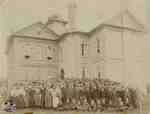 Class standing in front of school, 1893